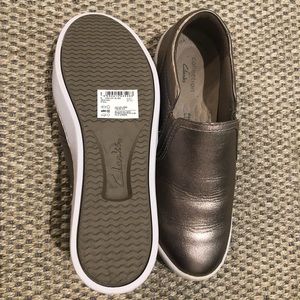 Metallic gold Clark’s slide on sneakers